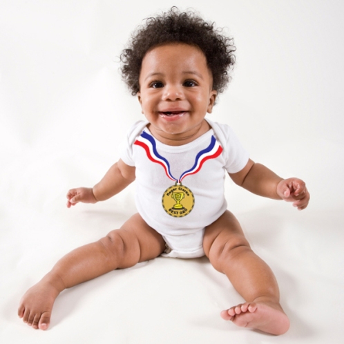 Happy African American baby sitting up, white background